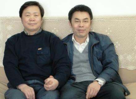 天略集团董事长丘振良与王副会长合影 